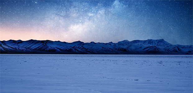 A Sprinter Van with snow falling